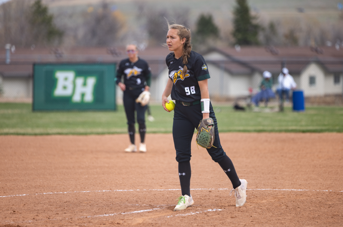 Laci Peskey, a sophomore starting pitcher on the BHSU softball team, steps into the circle during the UCCS game April 11.